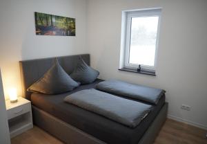 a couch with pillows on it in a room at Kelbergerly Hills in Kelberg