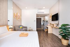 Телевизор и/или развлекательный центр в Infinity Pool Signature - Saigon Rivergate