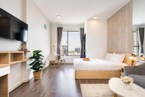 Телевизор и/или развлекательный центр в Infinity Pool Signature - Saigon Rivergate