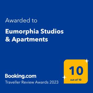 a yellow sign with the words awarded to europhilippinianstudios and experiments at Eumorphia Studios & Apartments in Skiathos