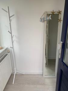 a bathroom with a mirror and a sign that reads exit at De Nollen in Egmond aan den Hoef +32 photos