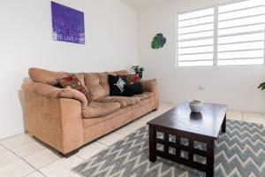 a living room with a couch and a coffee table at 1 BR, Dorado beach apartment 20% monthly discount in Dorado