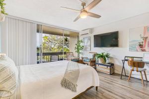 a bedroom with a large bed with a ceiling fan at Perfect Studio Condo in Kapalua with Ocean View Unit A18 in Kahana +24 photos