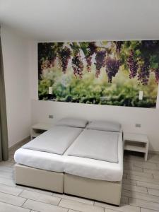 Postel nebo postele na pokoji v ubytování Agriturismo Vin e Amor