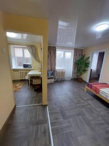 a large room with a bed and a desk at Оренда затишної 2 кімнатної квартири в самому серці Рівного in Rivne