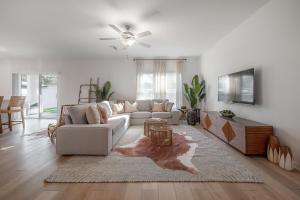a living room with a couch and a table at New Construction 1 mile from Downtown Ybor City in Tampa
