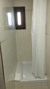 Koupelna v ubytování Hotel Raxa