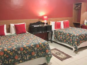 Łóżko lub łóżka w pokoju w obiekcie Suites Bouganville ( casa 2)