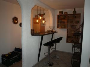 a room with a bar in the corner of a room at Ferienwohnung Ebbe in Attendorn