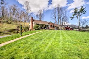 a house with a large lawn in front of it at Scenic Canton Home with Sunroom - Near Asheville! in Canton
