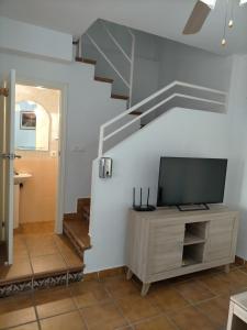 A television and/or entertainment centre at Alcaraván 32
