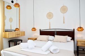 Postel nebo postele na pokoji v ubytování Louros rooms