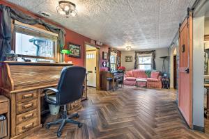 a home office with a desk and a chair at Pet-Friendly Bartlett Farmhouse with Deck! in Bartlett