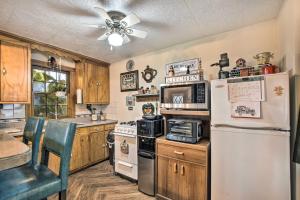 a kitchen with a refrigerator and a stove at Pet-Friendly Bartlett Farmhouse with Deck! in Bartlett