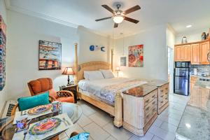 a bedroom with a bed and a living room at Naples Studio Near Everglades with Marina! in Naples