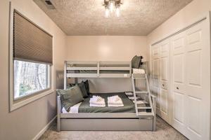 a bedroom with bunk beds in a room with a window at Massanutten Resort Cabin Walk to Amenities in McGaheysville