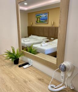 Postel nebo postele na pokoji v ubytování Karos Hotel Llaman