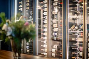 a wine cellar with a bunch of wine glasses at Le Mirabeau Resort & Spa in Zermatt