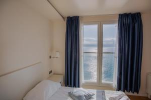 Rúm í herbergi á Hotel Pleter