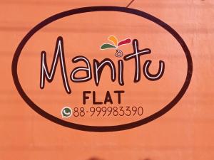 a sign for a marmite flat on a box at Manitu Flat Canoa Quebrada in Canoa Quebrada