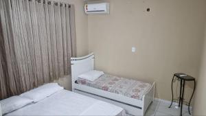 Katil atau katil-katil dalam bilik di RECANTO DO LUAR