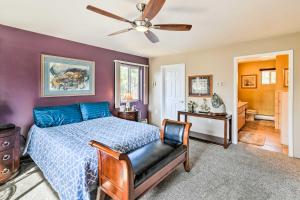 a bedroom with a bed and a ceiling fan at Hillside Anchorage Home by Hiking and Biking Trails! in Anchorage