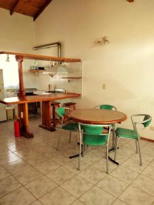 a dining room with a table and chairs at Alojamiento Casa en El Bolsón in El Bolsón