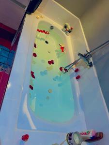 a bath tub filled with water in a room at la vue panoramique in Marrakech