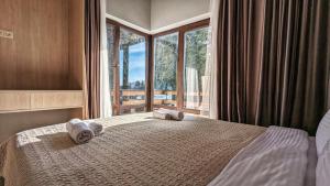 Postel nebo postele na pokoji v ubytování 7 Cottage in Bakuriani