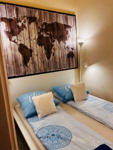 a bedroom with two beds and a map on the wall at Walkway Apartment Deluxe in Budapest