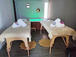Postel nebo postele na pokoji v ubytování Saint George Hotel - Spa & Temazcal