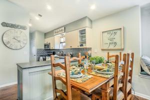 a kitchen and dining room with a wooden table and chairs at Holiday Hills Resort Condo Mins to Branson Strip! in Branson