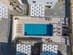 an overhead view of a swimming pool in a building at Matala Prime Villas in Matala