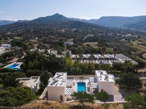 an aerial view of a villa with mountains in the background at Matala Prime Villas in Matala +37 photos