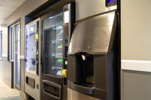 a kitchen with a pizza oven in a building at New Victorian Inn - Sioux City in Sioux City