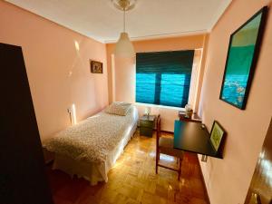 Ένα ή περισσότερα κρεβάτια σε δωμάτιο στο La Casina del Lavadero de Cudillero