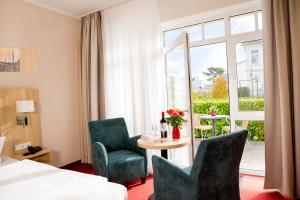 Ein Bett oder Betten in einem Zimmer der Unterkunft Hotel Garni Sonne