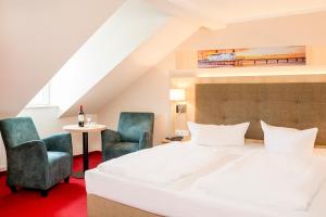 Ein Bett oder Betten in einem Zimmer der Unterkunft Hotel Garni Sonne