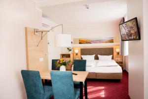Postel nebo postele na pokoji v ubytování Garni Eden Hotels