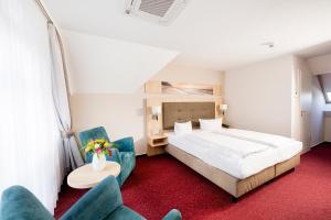 Postel nebo postele na pokoji v ubytování Garni Eden Hotels