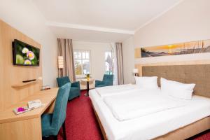 Postel nebo postele na pokoji v ubytování Garni Eden Hotels