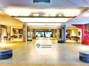 a lobby with a mall with a sign in the middle at Timurbay Seafront Residence byDiamond Studio Suites 1 plus 1 in Kuantan +25 photos