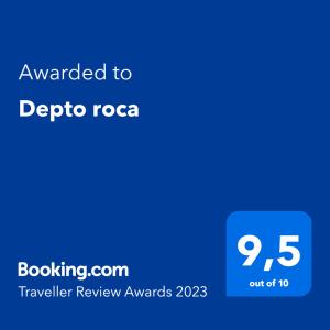 a blue sign with the text awarded to detrico rocca at Depto roca in General Roca