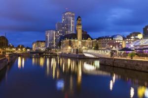 a view of a city with a river at night at The Sunset in Malmö