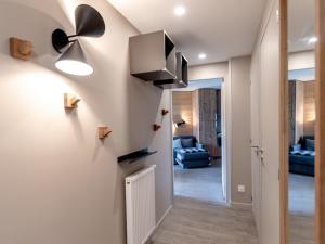 a living room with a hallway with a ceiling fan at Superbe appartement 56m², accès pistes, terrasse sud, 1 suite parentale, proche centre et ESF - FR-1-634-5 in Avoriaz
