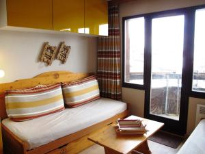 a small room with a bed and a table at Studio Avoriaz, 1 pièce, 4 personnes - FR-1-634-30 in Avoriaz