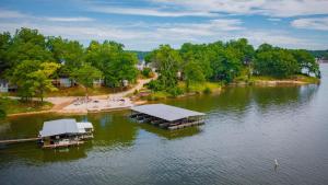 an aerial view of a dock on a lake at Lakeshore Fishing Cabin #3, Ramp, dock, fire pit in Lake Ozark