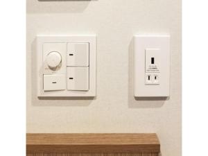 two white outlets on a wall with a wooden table at Sun Royal Utsunomiya - Vacation STAY 02522v in Utsunomiya