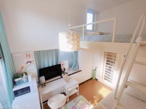 a small room with a bunk bed and a desk at Glen Stage 102 - Vacation STAY 13962 in Saitama