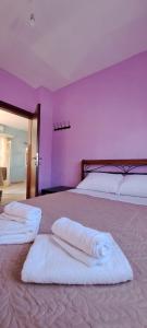 Postel nebo postele na pokoji v ubytování Villa Mitselo Apartments